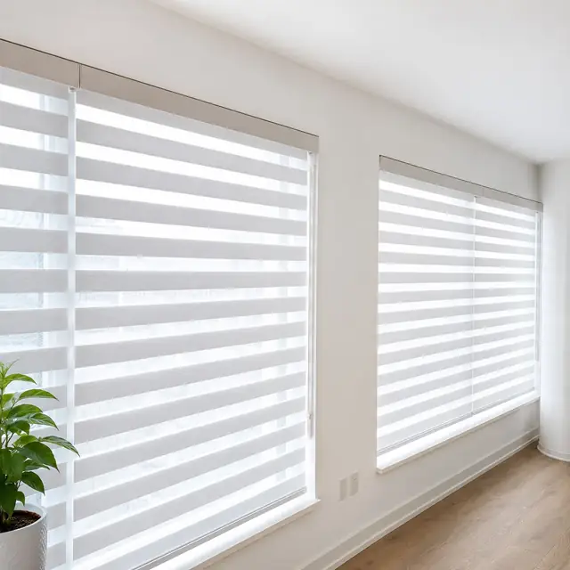White zebra blinds in a bright living room with plants