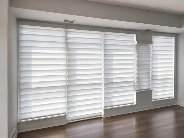 White zebra blinds across a sliding patio door